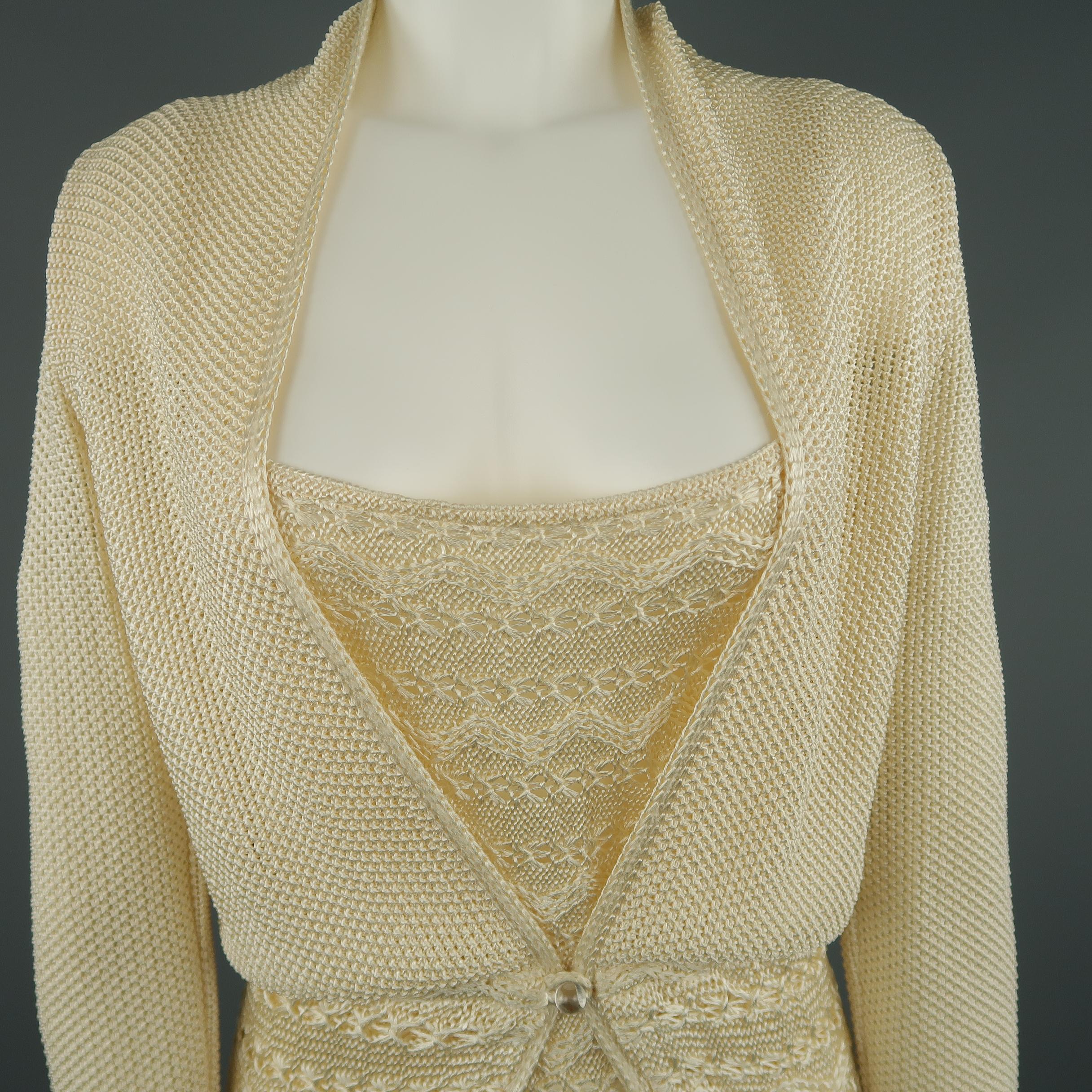 Vintage MISSONI sweater set comes in a cream rayon knit and includes a single button cardigan and matching double strap camisole. Made in Italy.
 
New with Tags.
Marked: 8
 
Measurements:
 
Cardigan:
Shoulder: 16 in.
Bust: 34 in.
Sleeve: 25