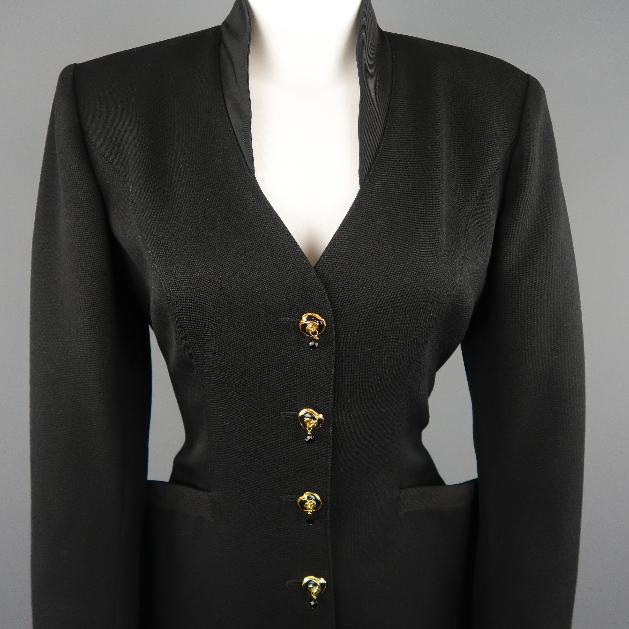 Vintage EMANUEL UNGARO dress comes in black twill with a high collar V neckline, side pockets, long sleeves with button cuffs, and button up front with yellow gold tone rose enamel buttons with bead accent.
 
Excellent Pre-Owned Condition.
Marked: