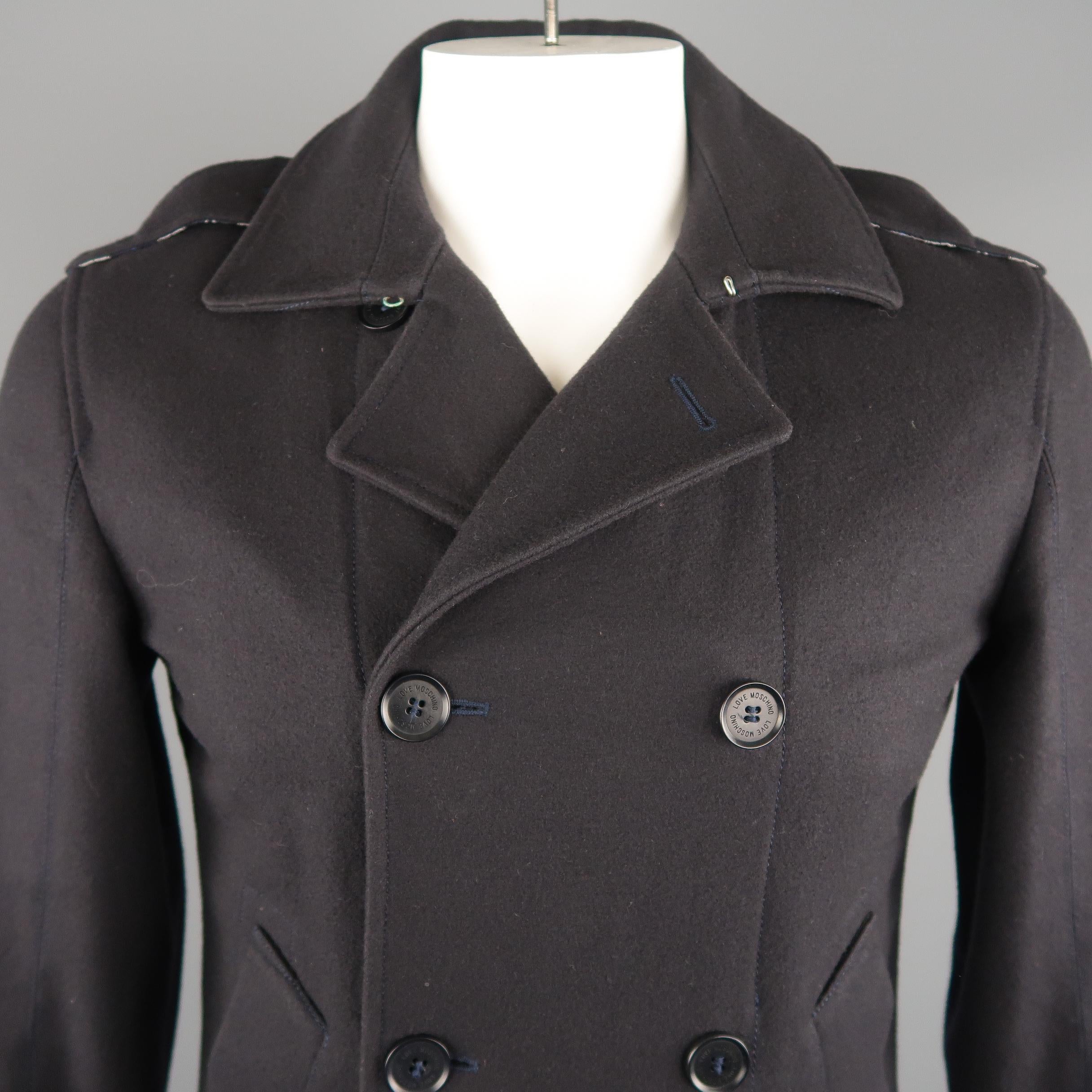 LOVE MOSCHINO peacoat comes in black tone in solid wool material, double breasted, with a slit pocket, shoulder and cuffs buttoned tabs.  Made in Italy.
 
Excellent Pre-Owned Condition.
Marked: 32
 
Measurements:
 
Shoulder: 17  in.
Chest: 43 