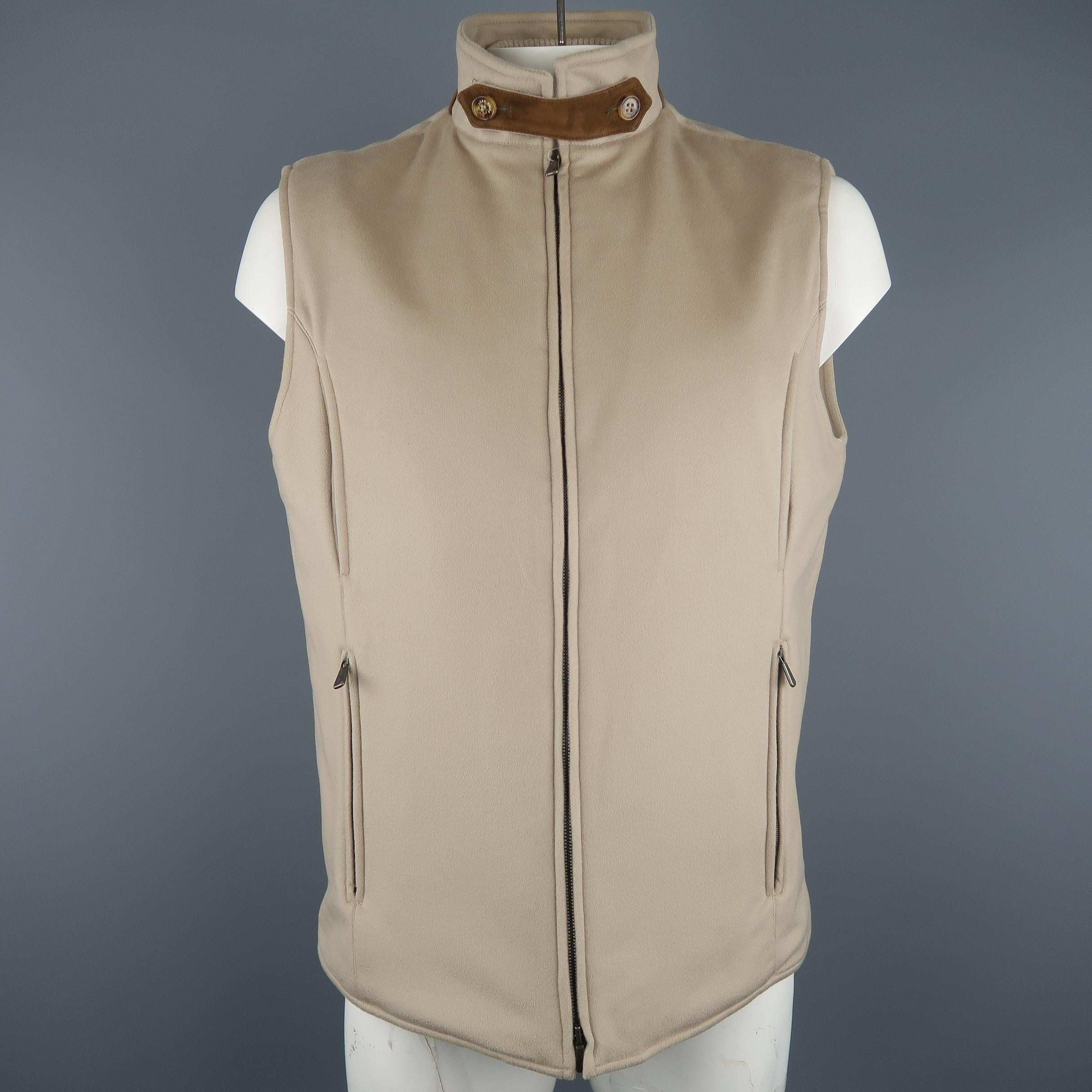 LORO PIANA Storm System vest comes in oatmeal beige cashmere with a high brown suede trimmed collar, double zip front, zip pockets, and ribbed cashmere knit inner collar. Made In Italy. Retail price $1,880.00
 
New with Tags.
Marked: XL
