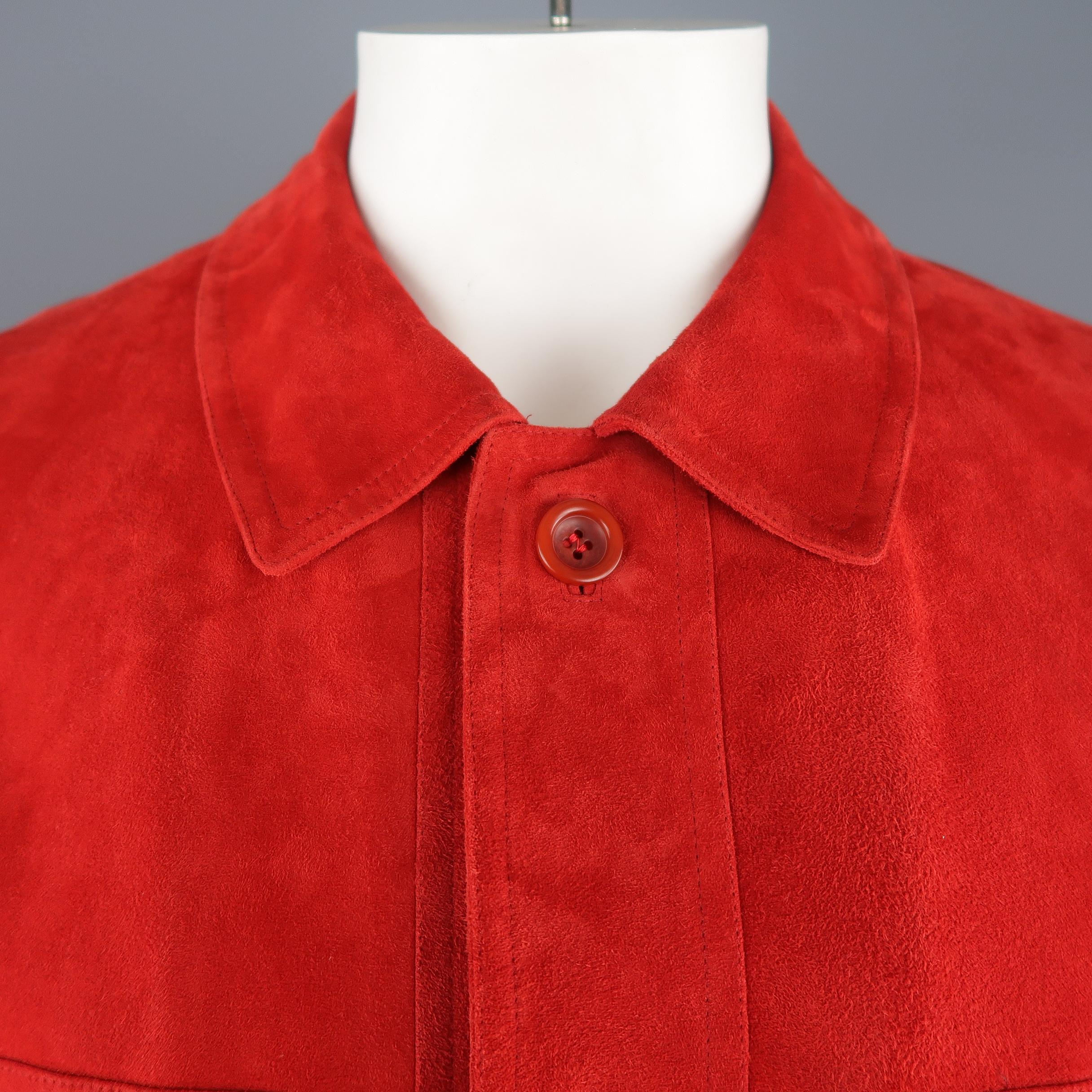 Vintage VALSTAR coat comes in vibrant orange red light weight suede with a pointed collar, button up front, four patch flap pockets, button cuffs, and drawstring waist. A couple small imperfections shown in detail shots. As-is. Made in Italy.
 
Good