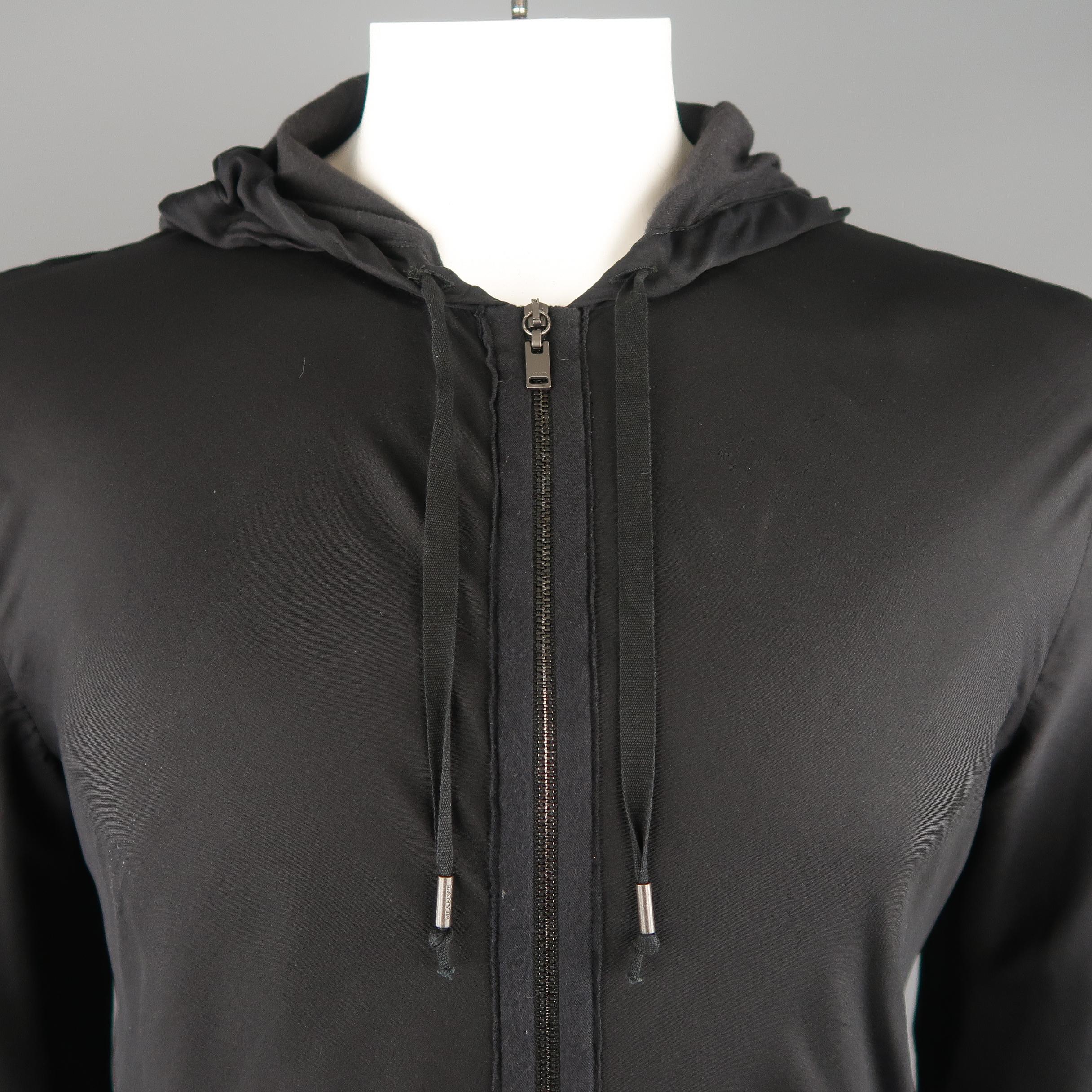 LANVIN hoodie comes in black jersey with a silk chiffon overlay featuring a zip front, pouch pocket, and drawstring hood.
 
Good Pre-Owned Condition.
Marked: L
 
Measurements:
 
Shoulder: 21 in.
Chest: 50 in.
Sleeve: 28 in.
Length: 29 in.