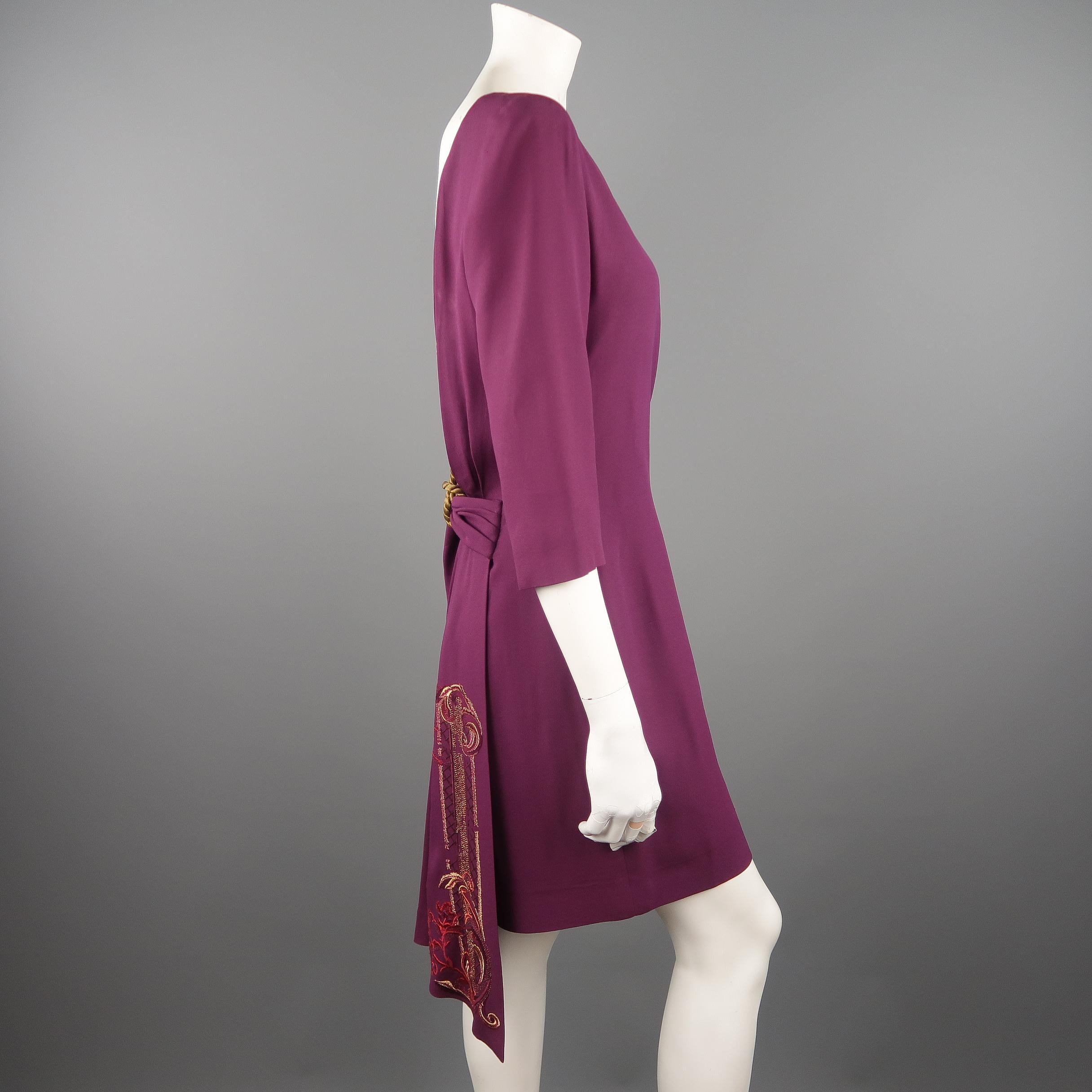 Vintage CHRISTIAN DIOR dress comes in orchid purple crepe with a boat neck, three quarter sleeves, open back with gold rope accent, and pleated draped details with embroidered sash. Minor wear throughout. As-is. Made in France.
 
Good Pre-Owned