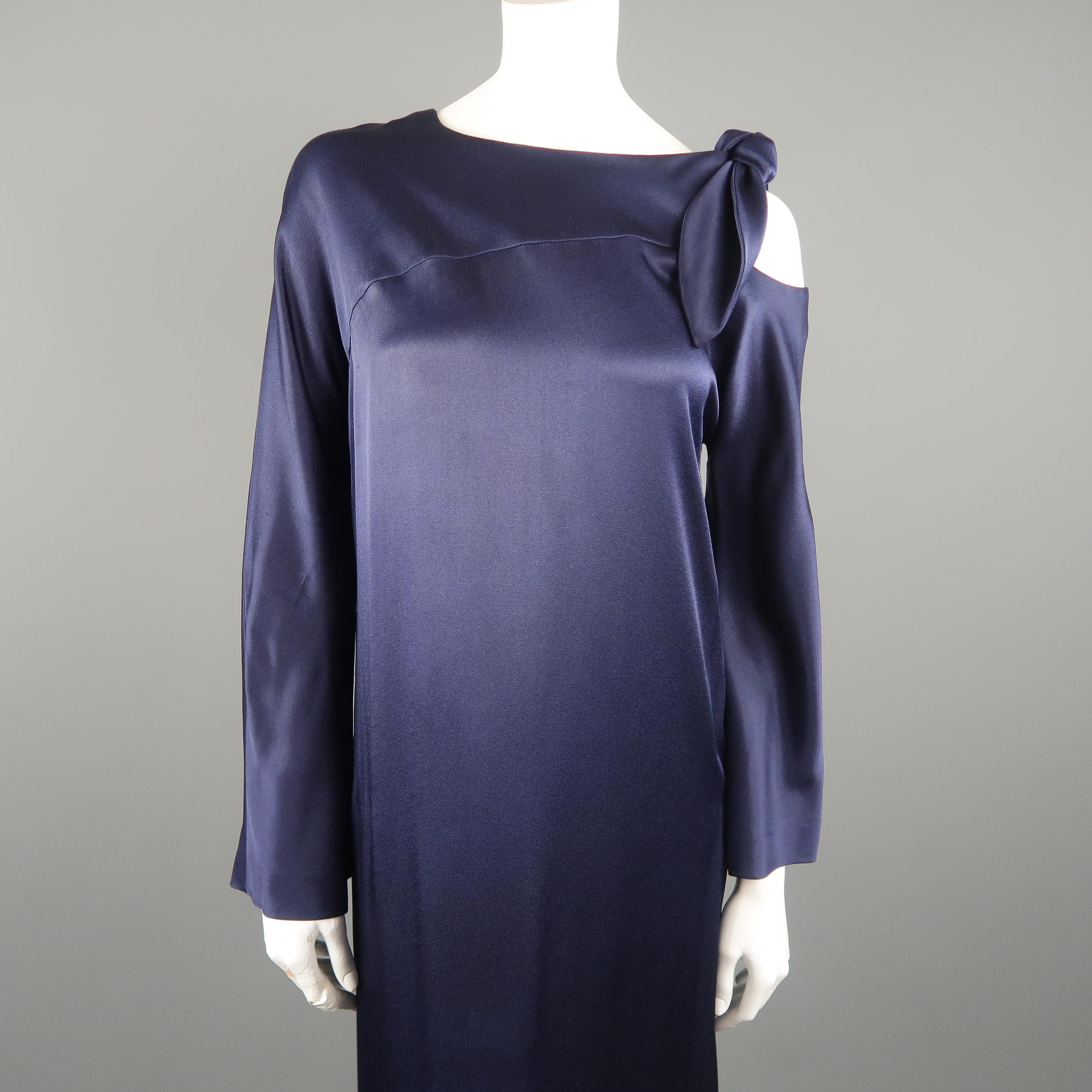 SALVATORE FERRAGAMO gown comes in navy blue textured satin with a round neck, A line silhouette, long flair sleeves, and cutout shoulder with tie detail. Care tag removed. Made in Italy.
 
Excellent Pre-Owned Condition.
Marked: (no size)

