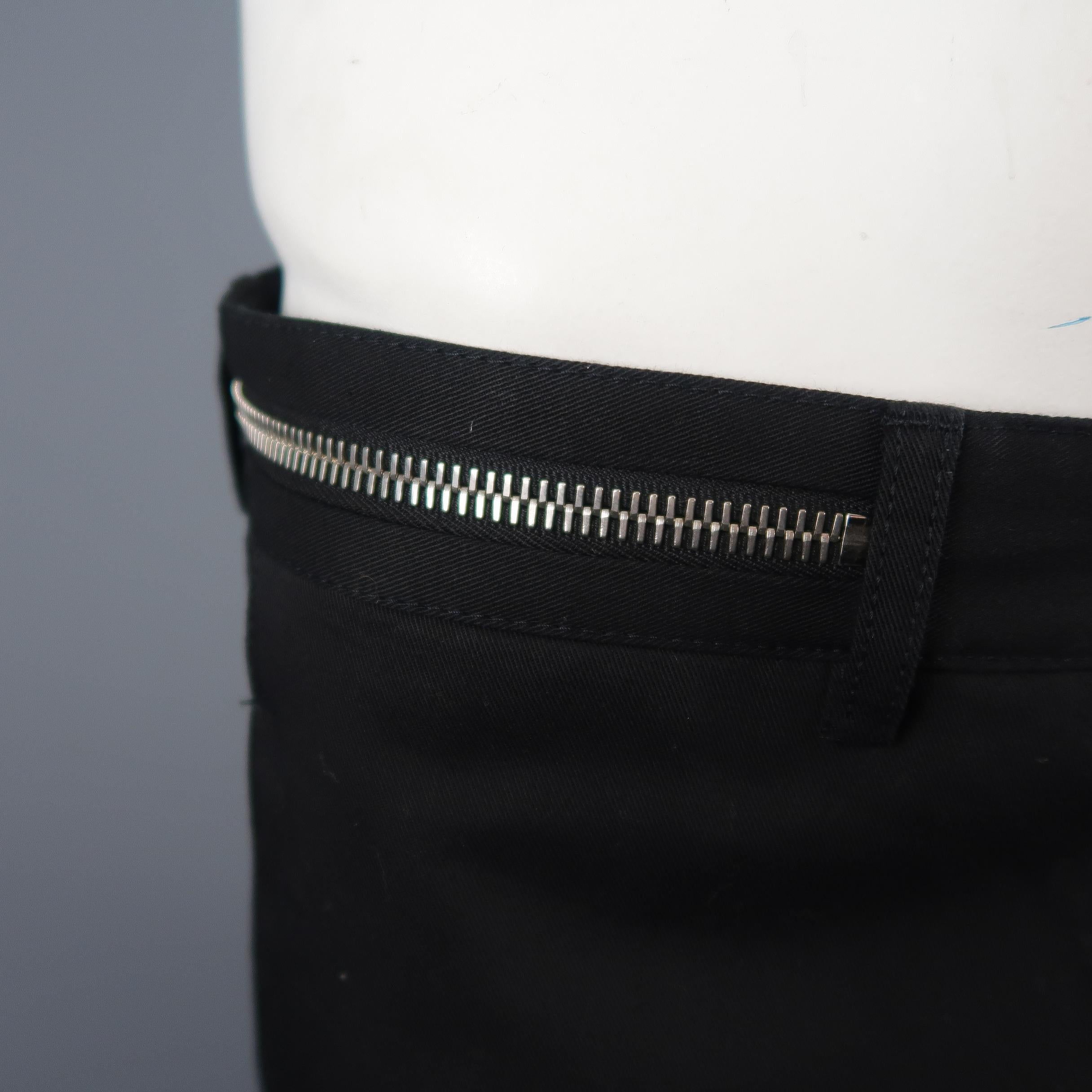 GIVENCHY by RICCARDO TISCI pants comes in black cotton twill with a tapered leg, silver tone zipper detailed waistband, and signature cross stitched back.
 
Excellent Pre-Owned Condition.
Marked: IT 52
 
Measurements:
 
Waist: 36 in.
Rise: 10