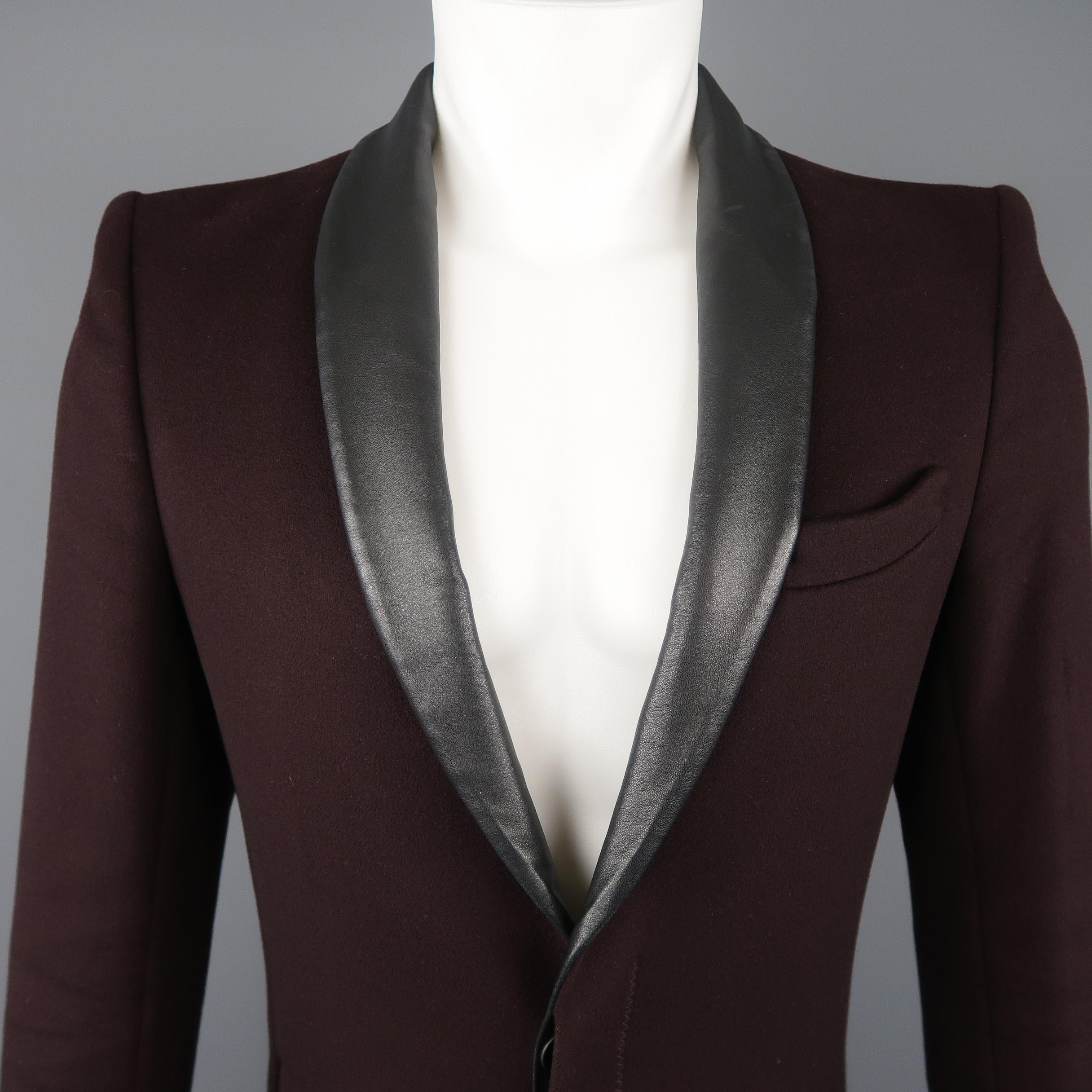 GAULTIER 2 by JEAN PAUL GAULTIER coat comes in plum felt with a hidden placket button up closure, slit pockets, zig zag top stitching, and faux leather shawl collar lapel.
 
Excellent Pre-Owned Condition.
Marked: 38
 
Measurements:
 
Shoulder: 18