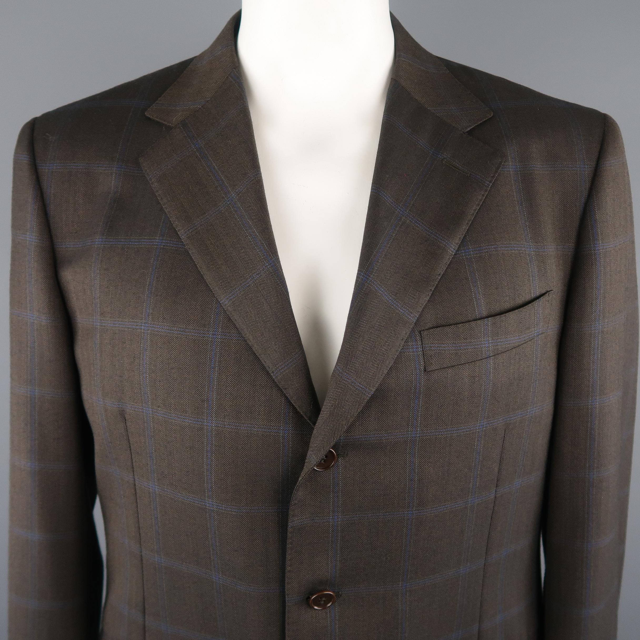 CANALI blazer comes in a brown tone in a window pane wool material, featuring a notch lapel, slit and flap pockets, 3 buttons closure, single breasted, functional buttons at cuffs and a regular fit. Made in Italy.
 
Excellent Pre-Owned