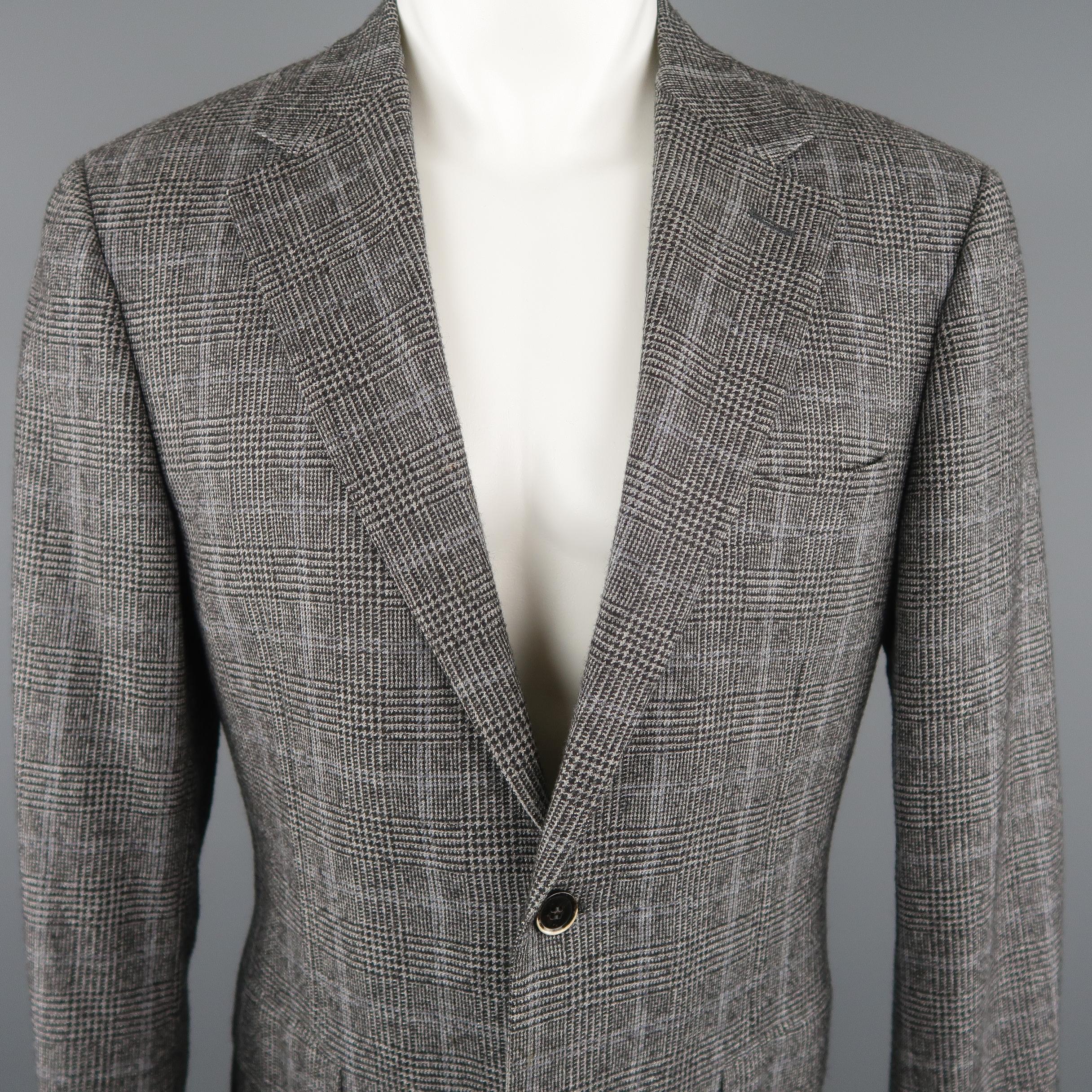 CANALI  blazer comes in black and grey tones in a glenplaid wool / cotton material, featuring a notch lapel, slit and flap pockets, 2 buttons closure, single breasted. Made in Italy.
 
Excellent Pre-Owned Condition.
Marked: 50R IT
 
Measurements:
