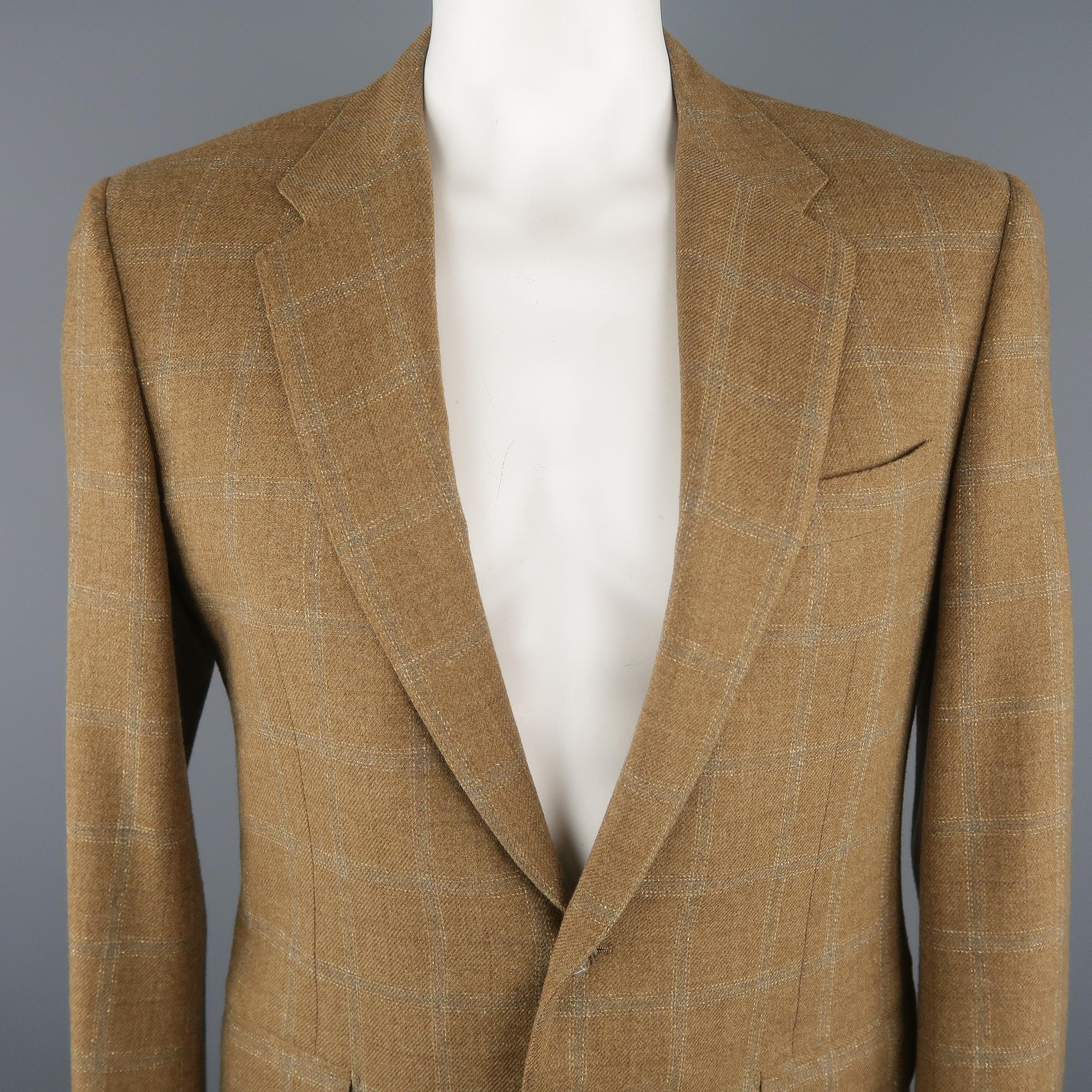 CORNELIANI blazer comes in a tan tone in a window pane wool / cashmere material, featuring a notch lapel, slit and flap pockets, 2 buttons closure, single breasted and a regular fit. Made in Italy.
 
Excellent Pre-Owned Condition.
Marked: 50R IT
