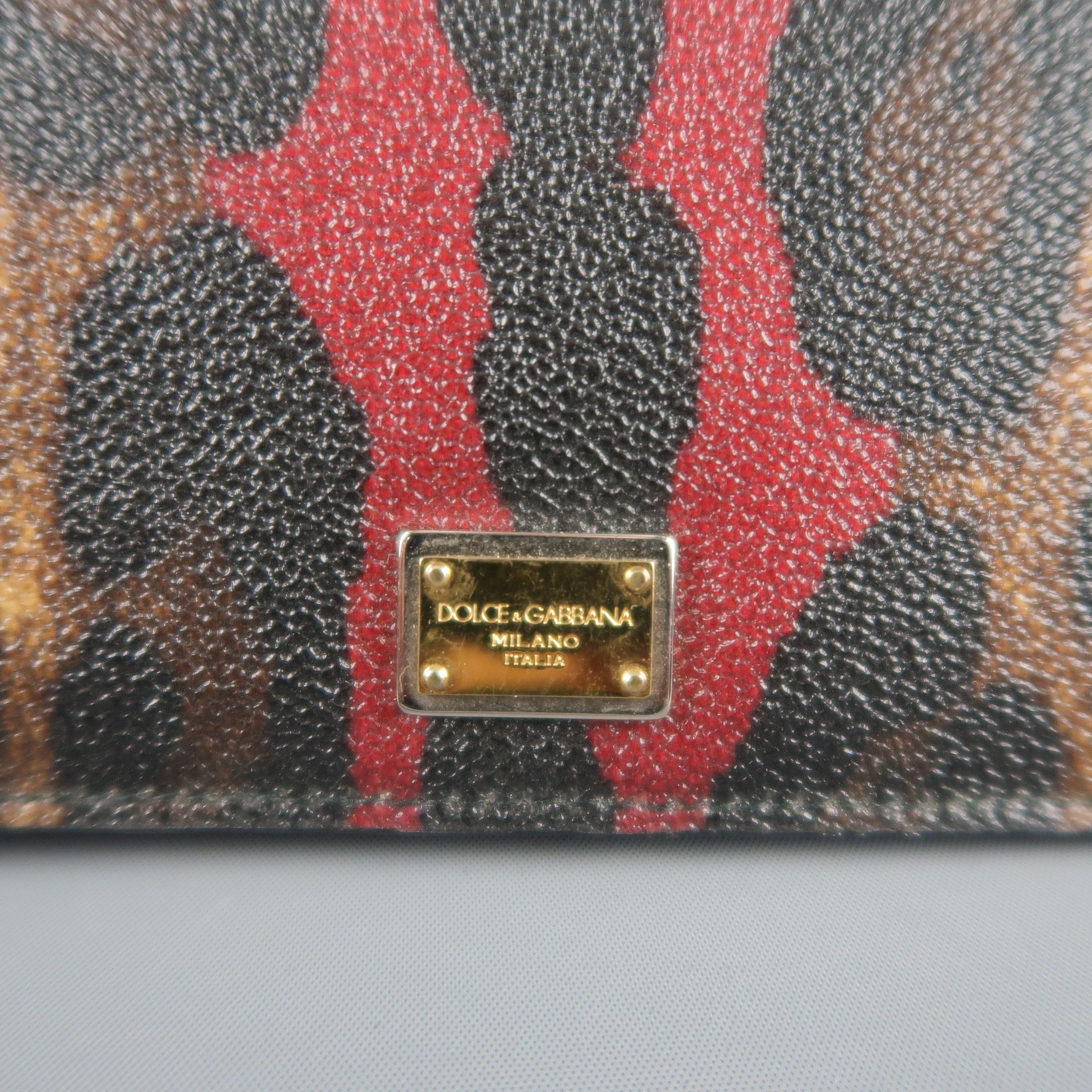 DOLCE & GABBANA tablet case comes in brown and burgundy leopard print textured coated canvas with a snap closure and black leather interior with card holders. Minor wear on interior. Made in Italy.
 
Good Pre-Owned Condition.
 
8 X 10 in.