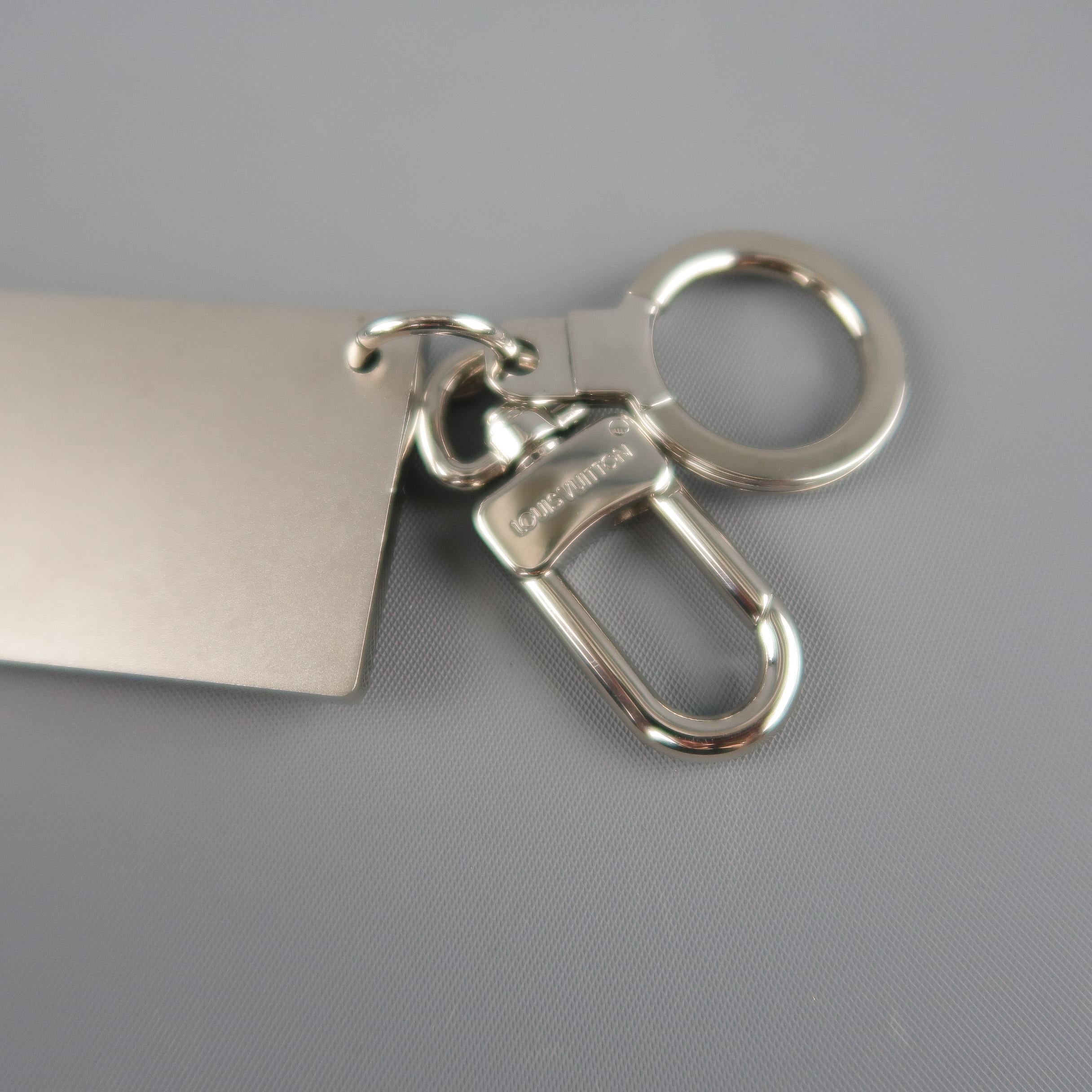 LOUIS VUITTON Silver Tone Metal Travelling Requisites Paris Embossed Key Ring In Excellent Condition In San Francisco, CA