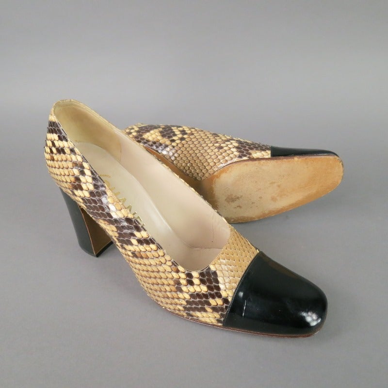 Amazing classic CHANEL pumps in snake skin and leather.  Black square cap toe and thick, sturdy heel.  What else is there to say but they're fabulous!?  Made in France.

Tag Size: FR 40  Fits Like: US 10
 
Measurements:
 Heel: 3 1/4 in.
