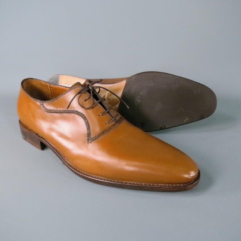 Beautifully smooth tan leather derby lace ups by A. Testoni.  Pointed toe, darker toned double topstitching at lace placket makes for a nice design detail.  Wooden, leather stack heel and sole with TOPY rubber.  Made in Italy.
Marked Size: