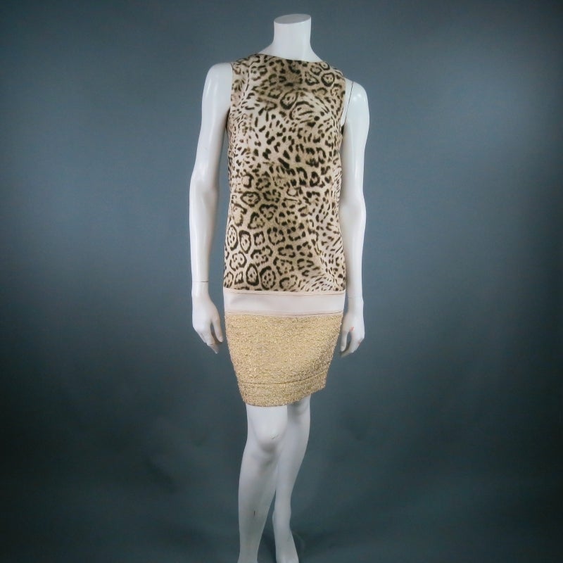 Color block sheath dress by GIAMBATTISTA VALLI. A structured mod inspired style in cheetah print featuring a crew neckline and metallic gold textured panel with cream stripe. Made in Italy.

Marked:  P2013/SV5007

Excellent pre-Owned