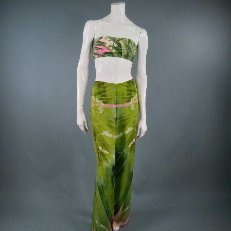 Fabulous 3 piece Resort ensemble by OSCAR DE LA RENTA. A stunning and weightless look in beautiful tropical palm print with pink accents, the set features a silk chiffon scarf poncho blouse, wide leg trousers, and a matching stretch tube top. Wear