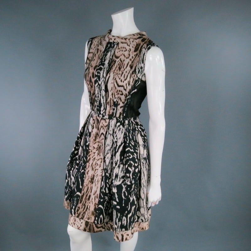Gorgeous mixed animal print wool blend cocktail dress by LANVIN. Another innovative and elegant style, this look comes in leopard cheetah print fabric that has been flipped, reversed, and constructed in panels with 