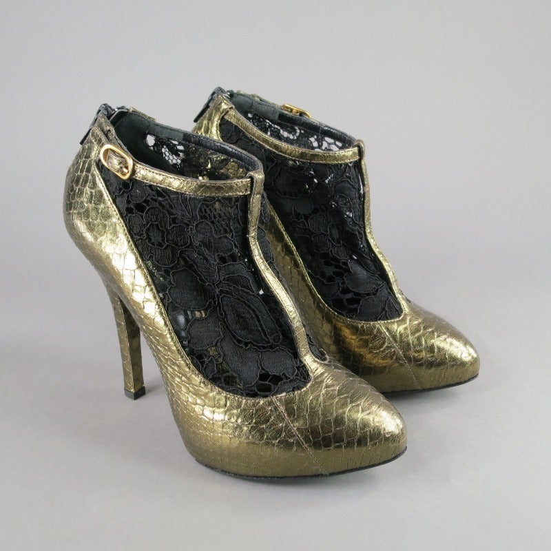 Stunning black and gold pumps by DOLCE & GABBANA. This pair features black lace, Python skin and t-strap. They are brand new with box. Made in Italy.
 
Excellent Pre- Owned Condition.
 
Measurements:
 
Heel – 5 inches