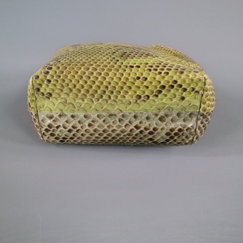 Gorgeous Green python leather sack purse by CHRISTIAN DIOR. An amazing and unique piece featuring a two tone motif, silver beaded strap, and snap closure.
 
Excellent Pre-Owned Condition.
 
Measurements:
 
Length: 11 in
Width: 6 in.
Height: