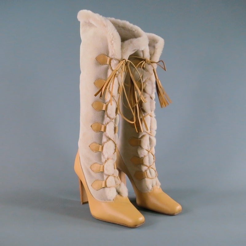 Stunning shearling snow boot heels by MANOLO BLAHNIK. A twist on a classic style, these boots lace-up to the knee with tan leather accents and a stacked heel.
 
Excellent Pre-Owned Condition.
 
Measurements:
 
Heel: 4 in.