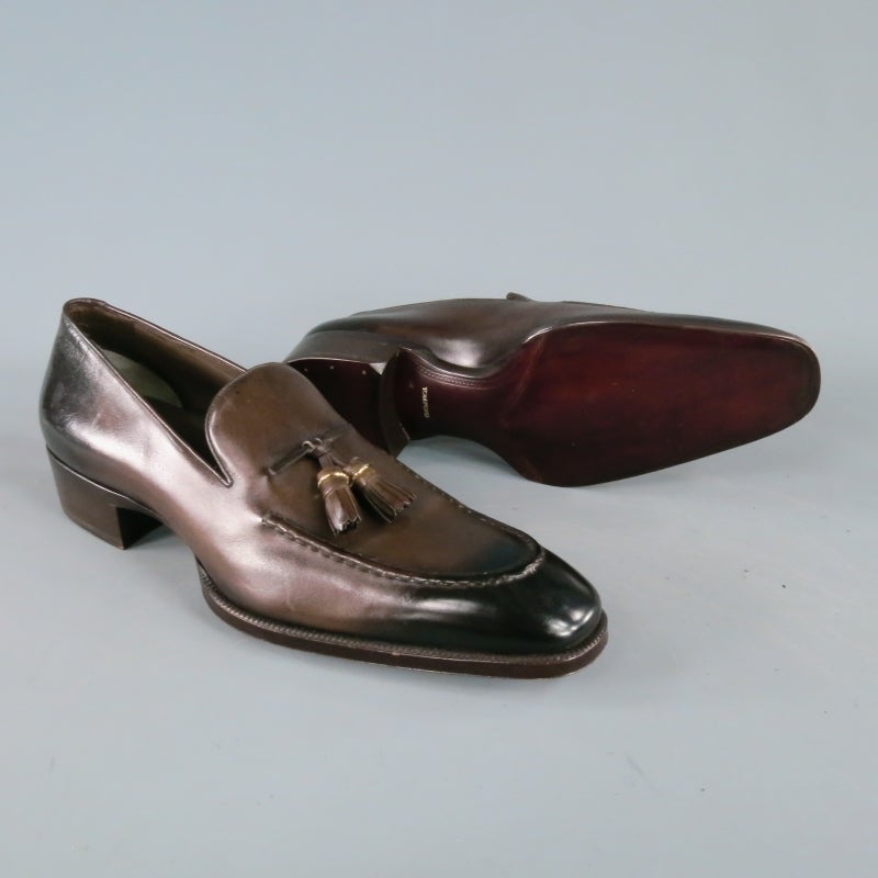 Brand New Tom Ford Slip On Loafer consists of a leather material in a brown color tone. Designed with a burnished calfskin exterior, double vamp tassels with silver hardware rings, top edge tone-on-tone stitching. Goatskin lining, 1 inch heel and