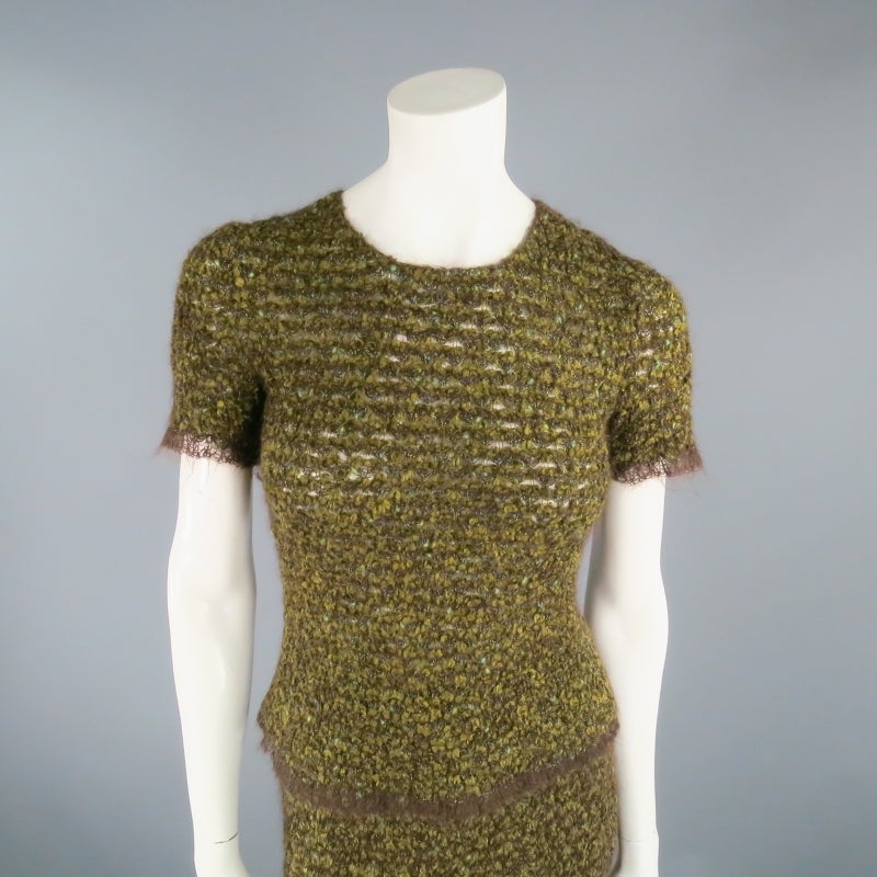Fabulous Vintage 1998 knit skirt set by CHANEL. In a textured loose knit in various green and earth tones, this look includes a short sleeve top and pencil skirt, both finished in brown textured piping and embellished with 