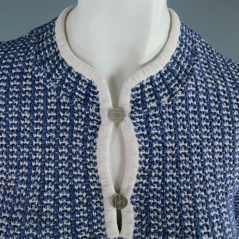 Lovely nautical sweater by CHANEL. In a medium weight blue and white cotton blend, featuring 3/4 sleeves, white piping, and a henley collar that closes with two silver tone 