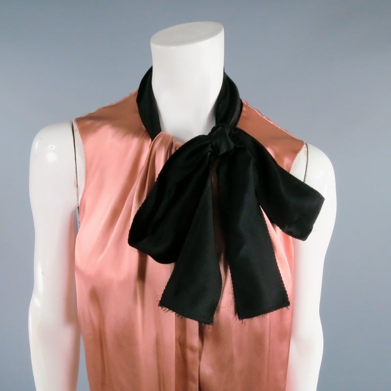 Lovely sleeveless dress top by LANVIN River 2006. In a gorgeous rose satin featuring a pleated neckline with black band tie collar. A unique and elegant piece with timeless appeal. Made in France.

Excellent Pre-owned