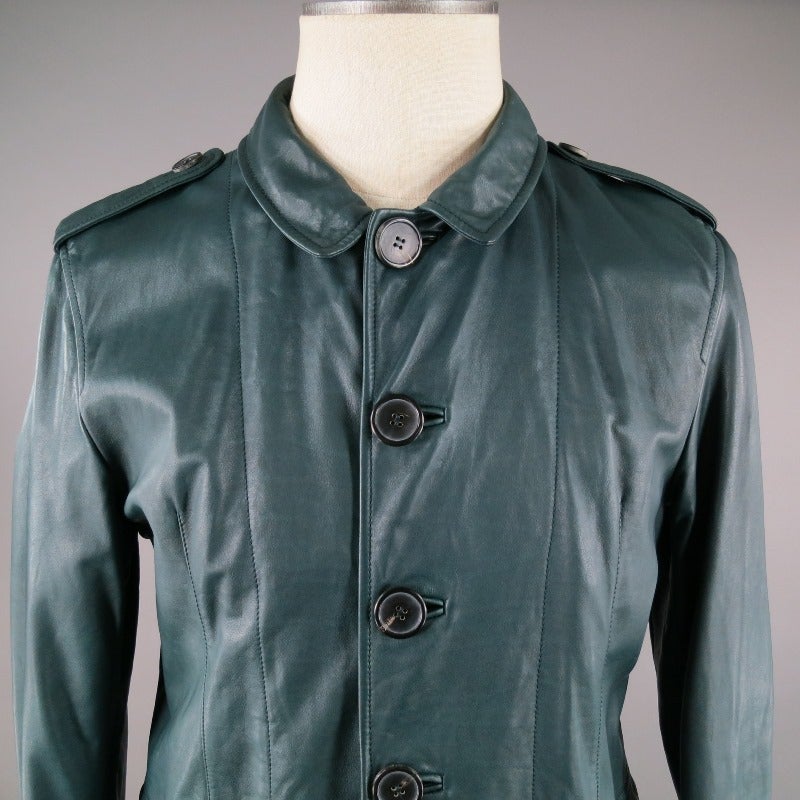 This hunter green LANVIN leather jacket includes large button center front closure, flap pockets and folded cuffs.  Button tabs at shoulders.  Notch Collar.  Back waist belt is adjustable on the interior. Slightly flared silhouette. Made in Italy.
