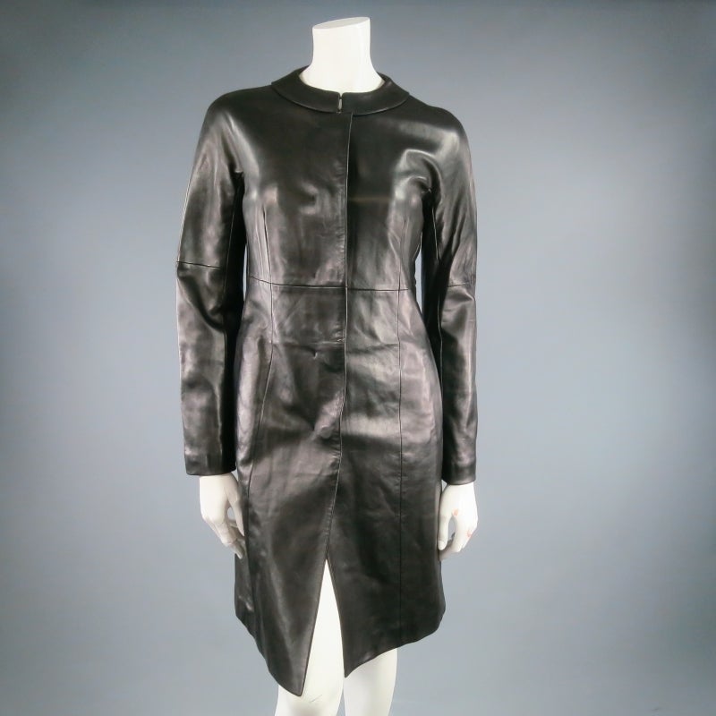 Fabulous soft cuir (boiled) leather coat by JIL SANDER. Inspired by a classic 1960's  babydoll dress, this piece comes in a tailored A line silhouette and features a hidden button closure with placket and standing band collar with hook eye closure.