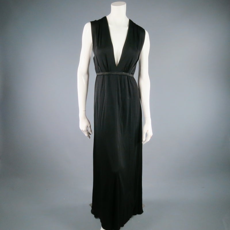 Gorgeous black rayon maxi dress by MARC JACOBS. A sleeveless, floor length style featuring a deep V neck line, raw edge panel details with metallic stitching, and tied waist and neck on the back. Wear it casual or dress it up. Made in the USA.
