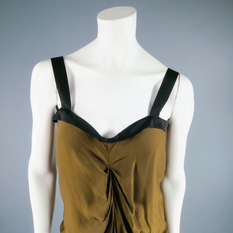 Fabulous mustard gold silk summer dress by LANVIN. A lightweight style with black piping and straps featuring a gathered draped bodice with elastic drawstring waist. Perfect for cocktail or every day. Made in France.
 
Excellent Pre-Owned
