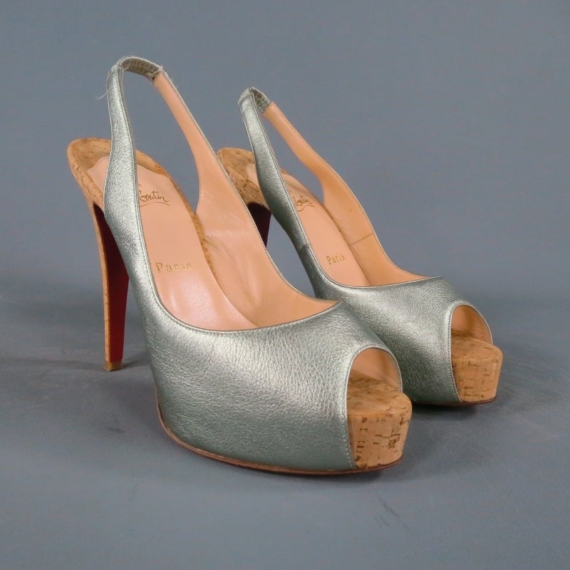 Fabulous platform pumps by CHRISTIAN LOUBOUTIN. A sexy shoe for summer, this style comes in a metallic pastel mint leather and features a peep toe, sling back, and cork platform and heel with signature red bottom sole. Made in Italy.
 
Like new