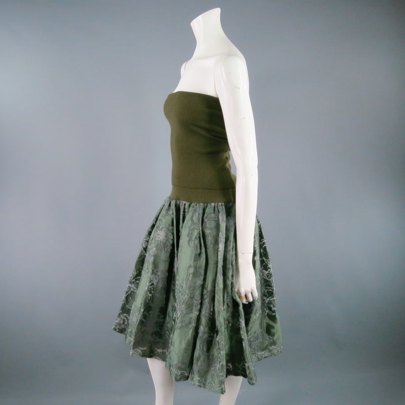 Strapless avant garde dress by JUNYA WATANABE for Comme Des Garcons. A unique mixed fabric style featuring an olive ribbed knit tube top that folds over with a layered floral burnout skirt with gathered top. Made in Japan.
 
Brand New With Tags.
