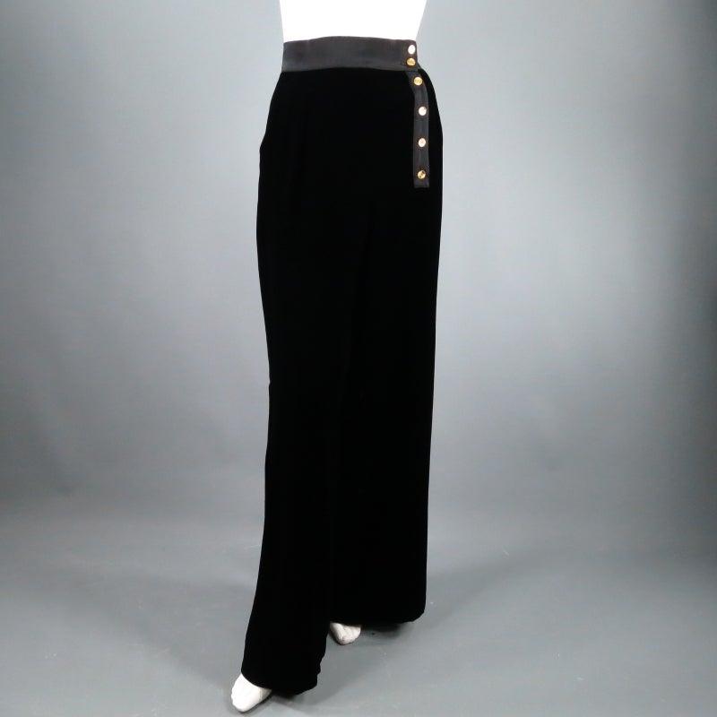 Gorgeous vintage CHANEL sailor pants. In a luscious black velvet with silk satin waist band, these flowing wide leg evening trousers feature an asymmetrical button detail with gold 