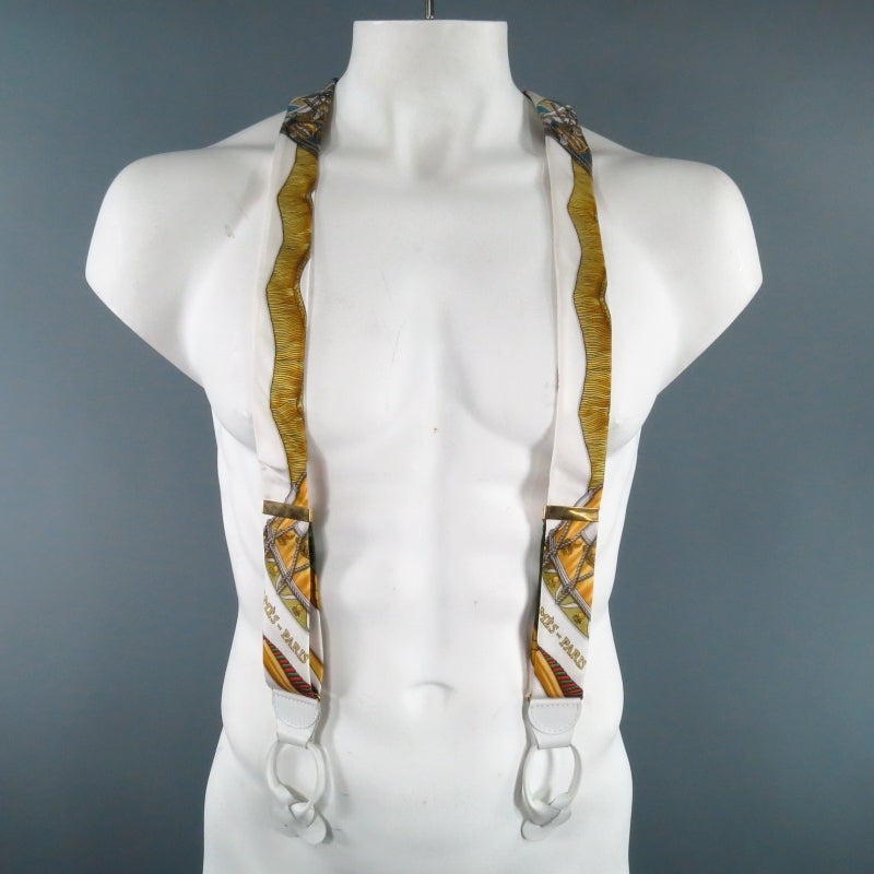 Classic, Collectors item suspenders by the luxurious HERMES.  Clasp adjustable gold and white leather hardware with elastic back.  Comes in a traditional iconic ornate print with ropes, tassels and chain.  Made in France.
 
Excellent Pre- Owned
