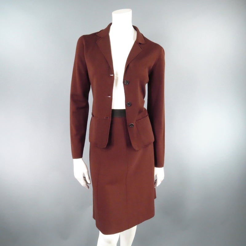 This set includes a cardigan and matching skirt. 

Lovely wool cardigan by LANVIN. This piece comes in a medium weight knit in rich brown wool and features a three button, notch lapel blazer cut and patch pockets. A staple for your fall winter