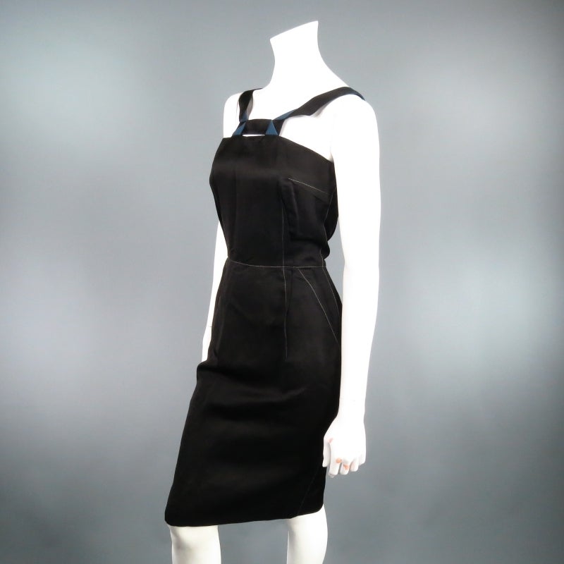 Fabulous fitted cocktail dress by LANVIN. This style comes in a shiny black viscose/linen blend and features outward dart construction with contrast stitching and geometric constructed black and teal V straps. Spring 2006 Collection. Made in