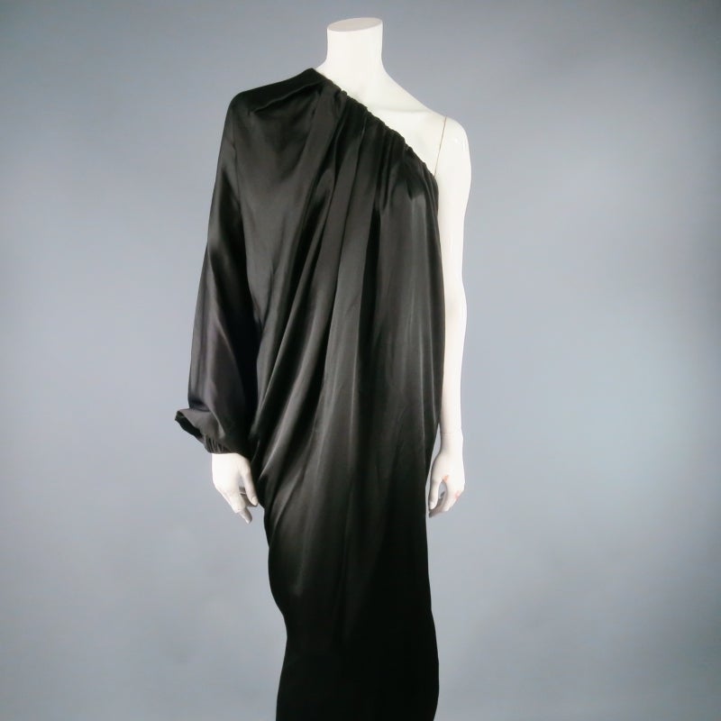 Stunning black silk column dress by LANVIN. A gorgeous full length cocktail dress from Spring 2007 reminiscent of a glamorous Erte' woman, this piece comes in a draped silk satin gathered and pleated along the neck line and features a draped Dolman