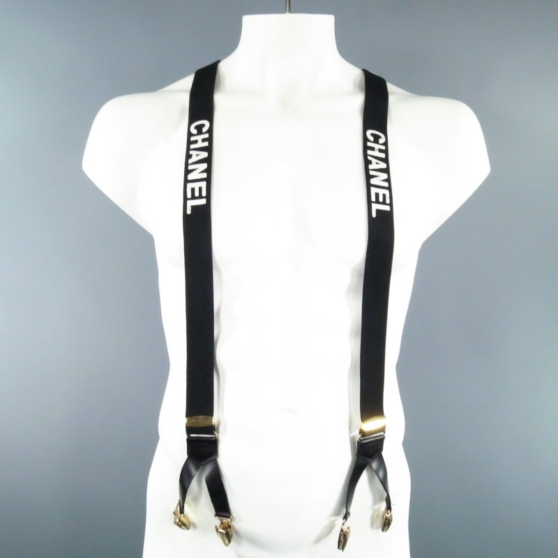 Vintage statement suspenders by CHANEL. A rare collector's piece from the archives, this style comes in black elastic with white 