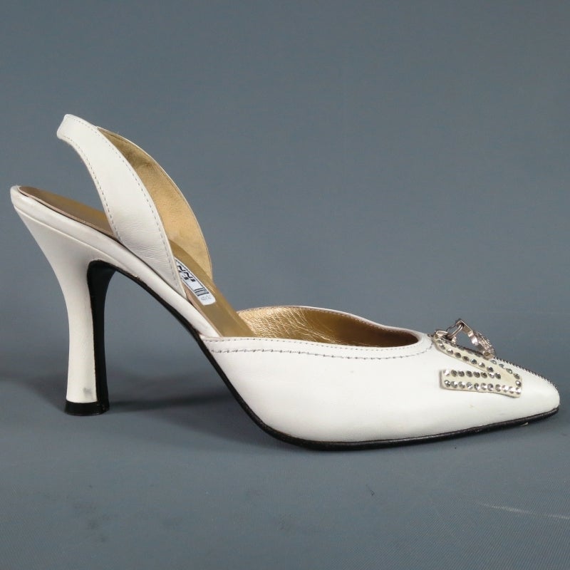 Fabulous white leather slingback pumps by GIANNI VERSACE. An iconic vintage style from the legendry fashion empire featuring a pointed toe with silver Medusa emblem zipper and sparkling rhinestone embellished suede 