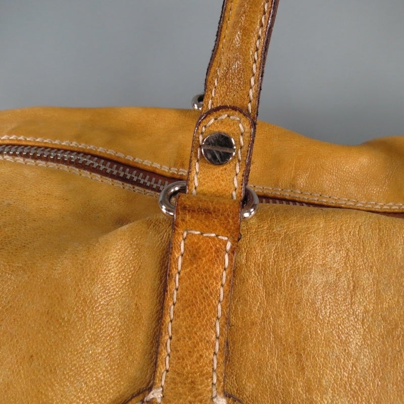 beige leather duffle bag