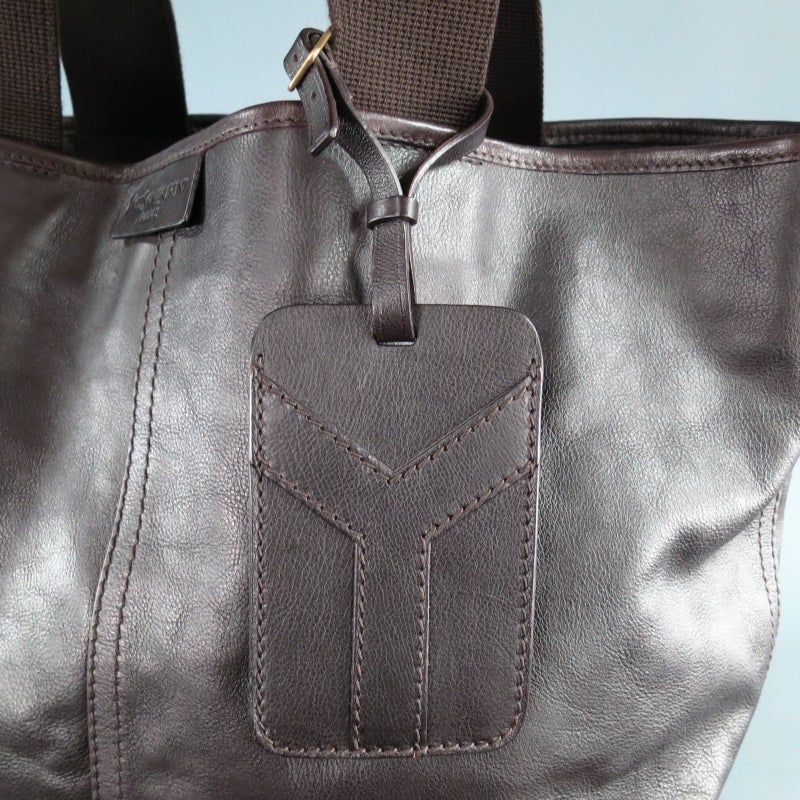 Large top handles tote bag by YVES SAINT LAURENT. A classic style deep chocolate brown smooth leather, featuring canvas handles with leather grip, embossed logo tag on outside, 