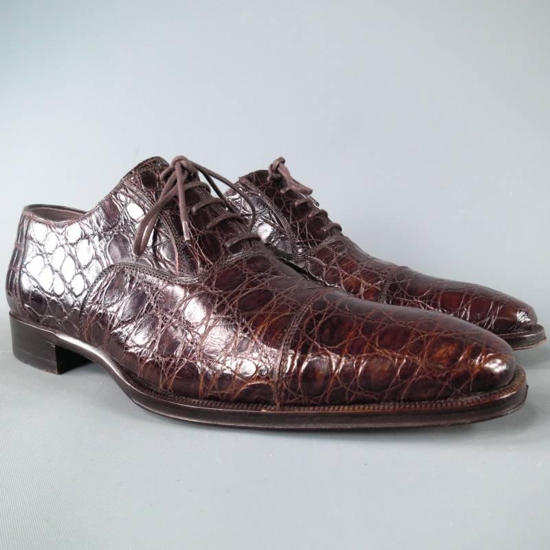 BERGDORF GOODMAN Lace Up Shoes consists of leather Crocodile material in a brown color tone. Designed with a textured appearance throughout body, cap-toe detail, round front and tone-on-tone stitching throughout body. Same color laces, brown leather