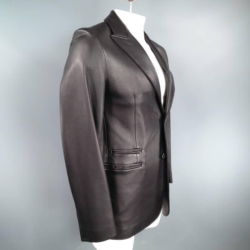 Leather two button sport coat by HERMES. This piece is made of a black textured deer skin leather and features a peak lapel, three slit pockets, and a center vent. Made in France.
 
Excellent Pre-Owned Condition.
 
Measurements:
 
Shoulders:18