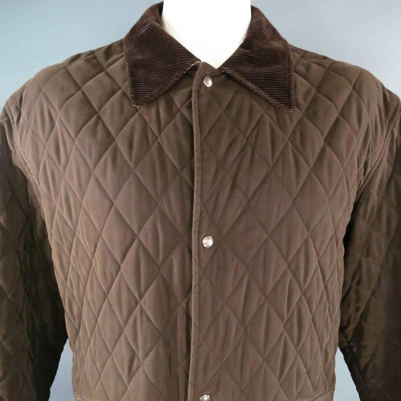 This great fall chocolate Jacket from Burberry London features a warm and durable quilted poly-blend throughout.  This amazing jacket also features a full contrasting signature Burberry plaid inside lining, a four snap button front closure and front