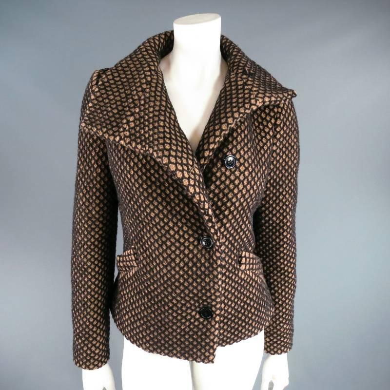 Fabulous RED LABEL by VIVIENNE WESTWOOD winter jacket. This revamped classic comes in a thick tan wool blend with black mesh texture and features an asymmetrical collar and button closure, frontal pockets, and unique asymmetrical back pleating for a