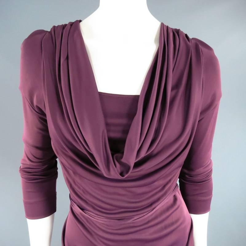Ultra chic RED LABEL by VIVIENNE WESTWOOD dress. This unique style comes in a gorgeous plum burgundy viscose and features a draped neckline with under layer, high side slit with built in slip, draped body with tied belt, and long sleeve. A very