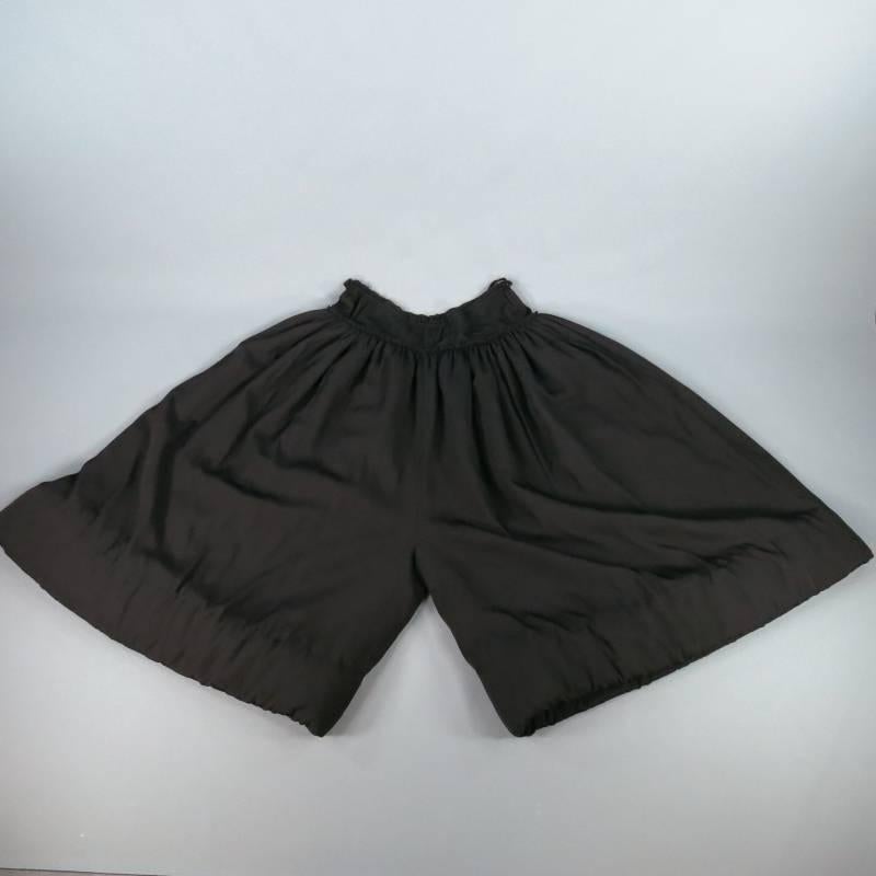 Ultra rare oversized runway pants by YOHJI YAMAMOTO. This avant garde style comes in a semi matte silk and features an exaggerated wide leg, drop crotch cut, drawstring waist with gathered ruffle detail, internal soft stuffing and top stitching at