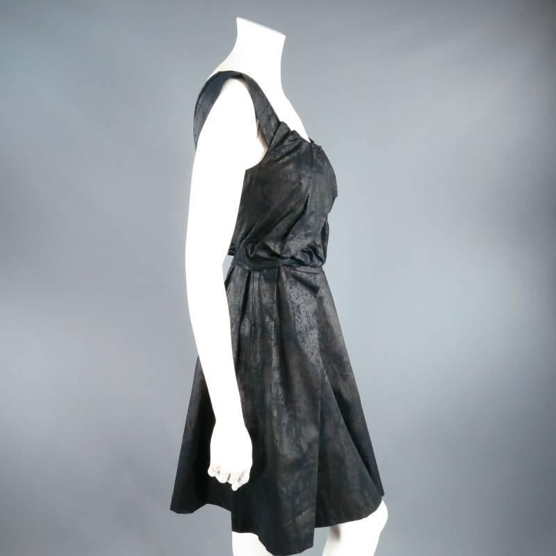 Fabulous ANGLOMANIA by VIVIENNE WESTWOOD cocktail dress. This fun and flirty style comes in a metallic black marble printed cotton and features a pleat draped bust, this straps that can be worn off the shoulder, and pleated full skirt. Perfect for