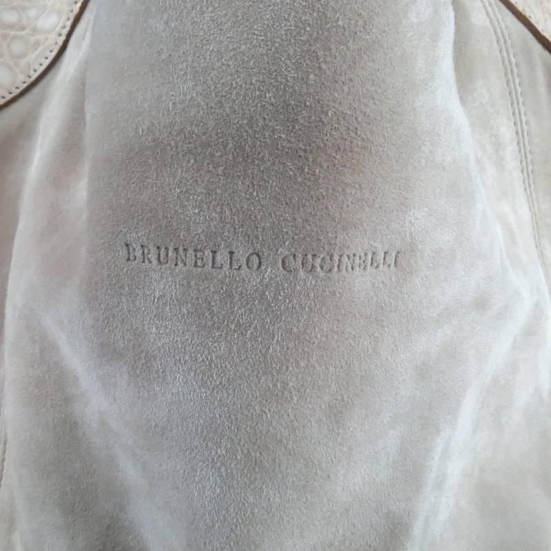 Gorgeous soft light beige suede tote bag by BRUNELLO CUCINELLI. This piece features matching thick crocodile embossed shoulder straps, D ring and buckle hook detail, and nylon lining with storage pockets. A beautifully crafted bag from the iconic